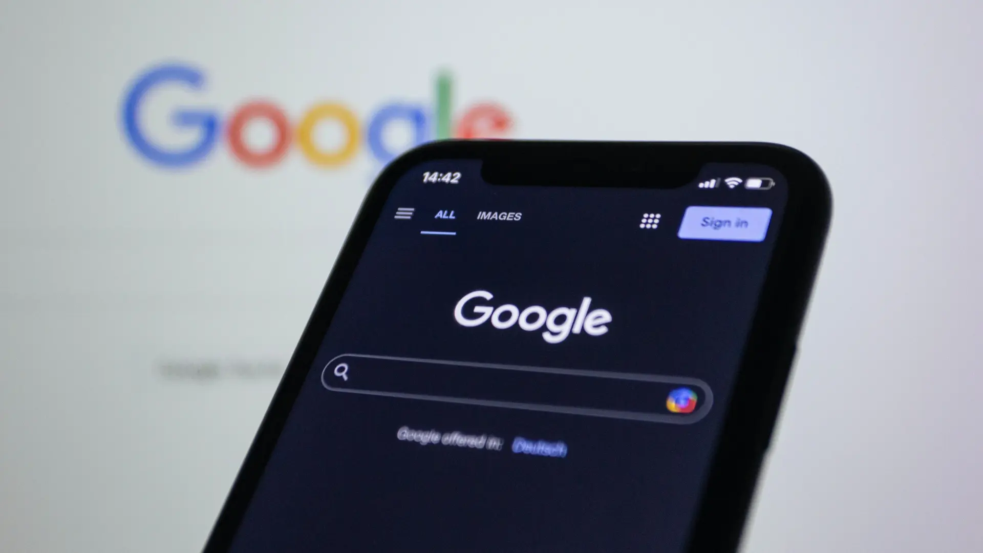 Photo of a phone with a Google opened up, indicating that Pixl offers SEO services